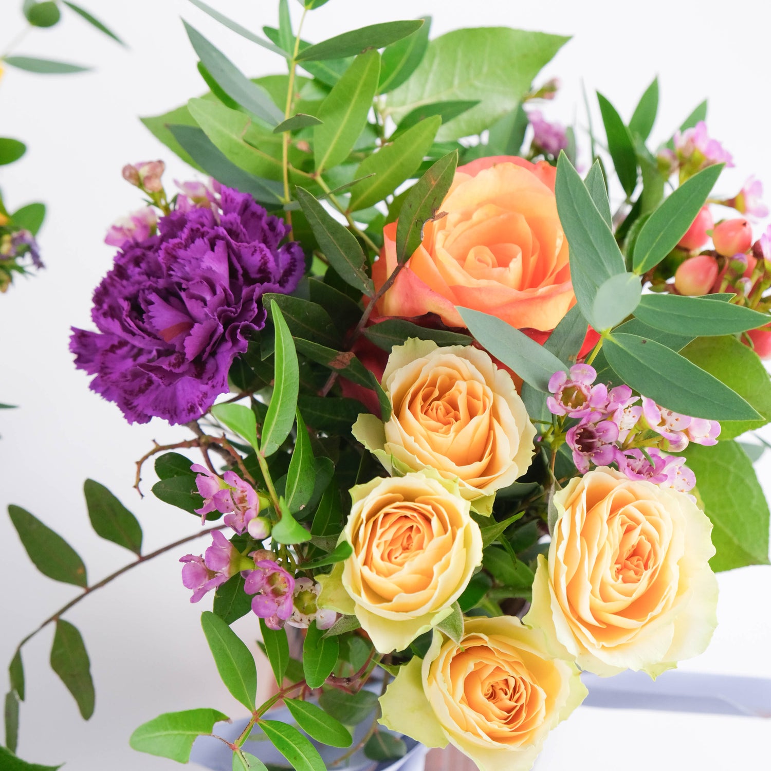 Fleurs dans un vase au choix du fleuriste